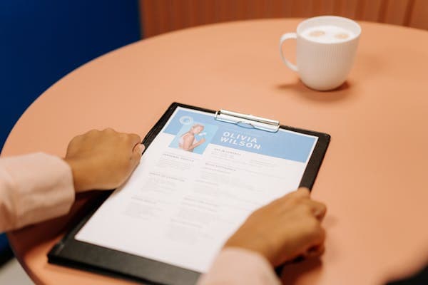 Person reviewing a finished resume
