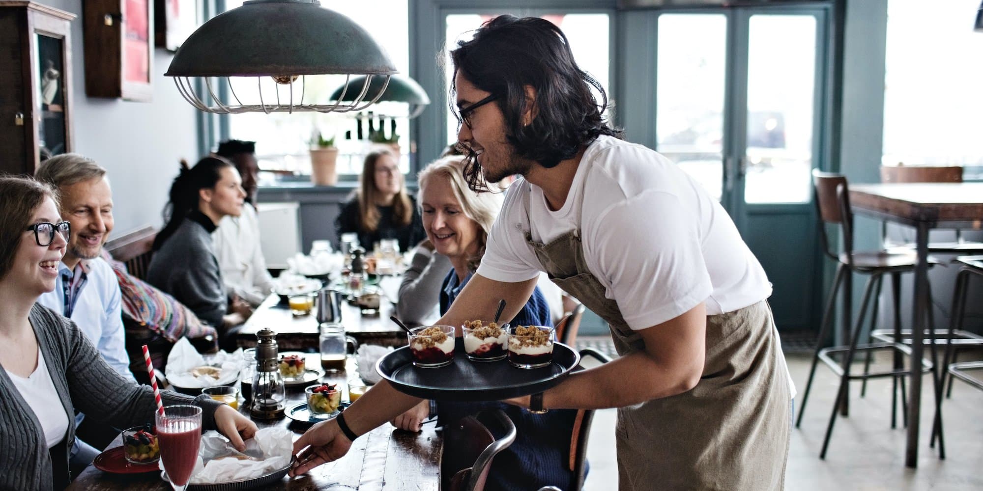 person working as server in a restaurant