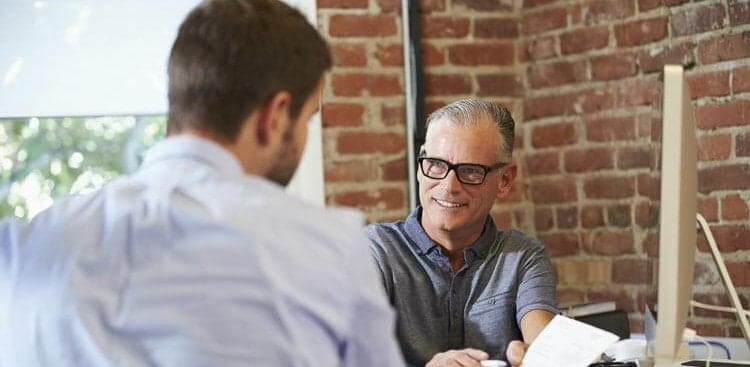 person talking to their boss